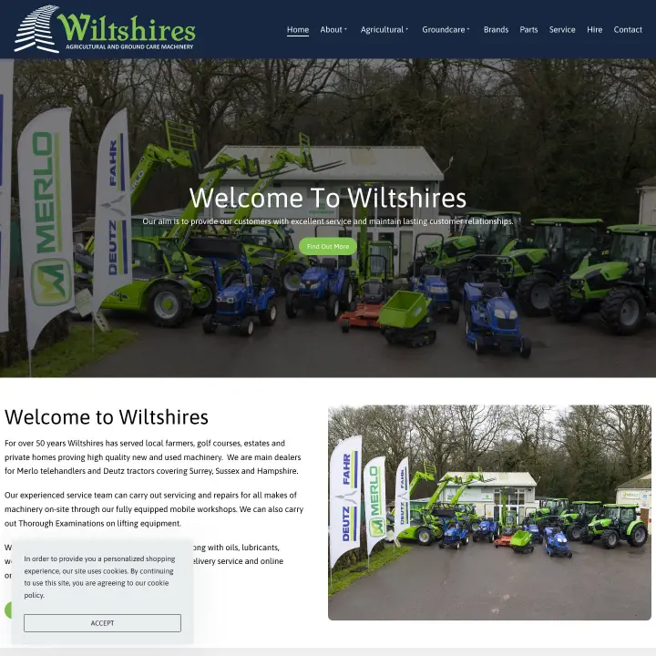 Agricultural and ground care machinery display at Wiltshires, featuring Merlo and Deutz branded equipment, showcasing tractors and telehandlers in a natural setting.