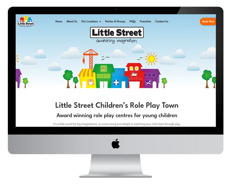 Web design display on an iMac featuring the Little Street website, showcasing colourful buildings and playful graphics, promoting children's role play centres with the tagline "awakening imagination."