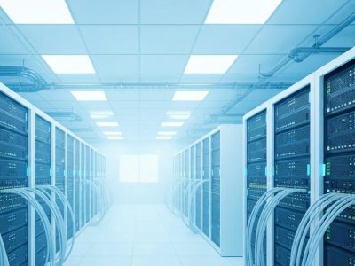 Data centre interior with server racks and cables, illustrating web hosting performance and security.