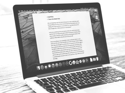 Laptop displaying text document on web design, illustrating digital design process and creativity.